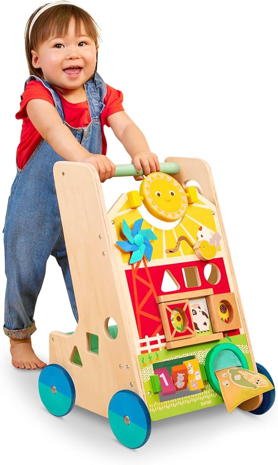 Battat Wooden Activity Walker, 9 Activities, Sunshine Farm Theme, Wood Toys | Farm-themed learning walker with mirror, pinwheel, shape sorter, 3 wooden shapes, rear storage, 4 handkerchiefs, 1+ Years