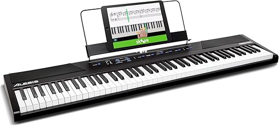 Alesis Recital - 88 Key Digital Piano Keyboard with Semi-Weighted Keys, 2x20W Speakers, 5 Voices, Split, Layer and Lesson Mode, FX and Piano Lessons